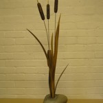 bullrushes, sculpture, hand carved, oak, stainless steel, burr elm, on a stone plinth,
