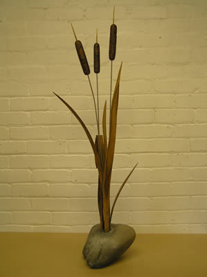bullrushes, sculpture, hand carved, oak, stainless steel, burr elm, on a stone plinth,