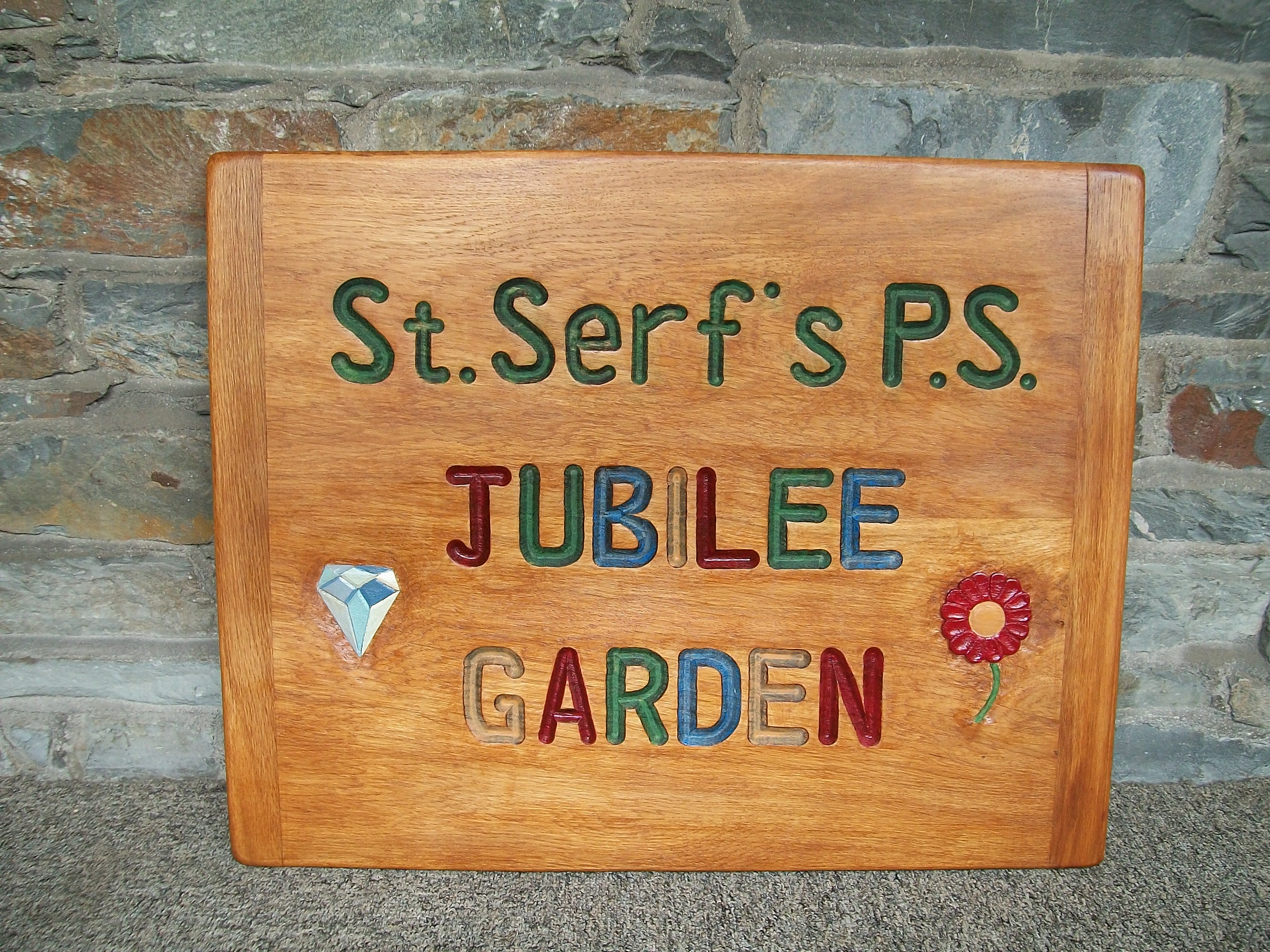 Jubilee garden sign, school playground, eco garden, sign, oak, hand-carved, hand-painted, friendship garden, designed by pupils, outdoor learning,